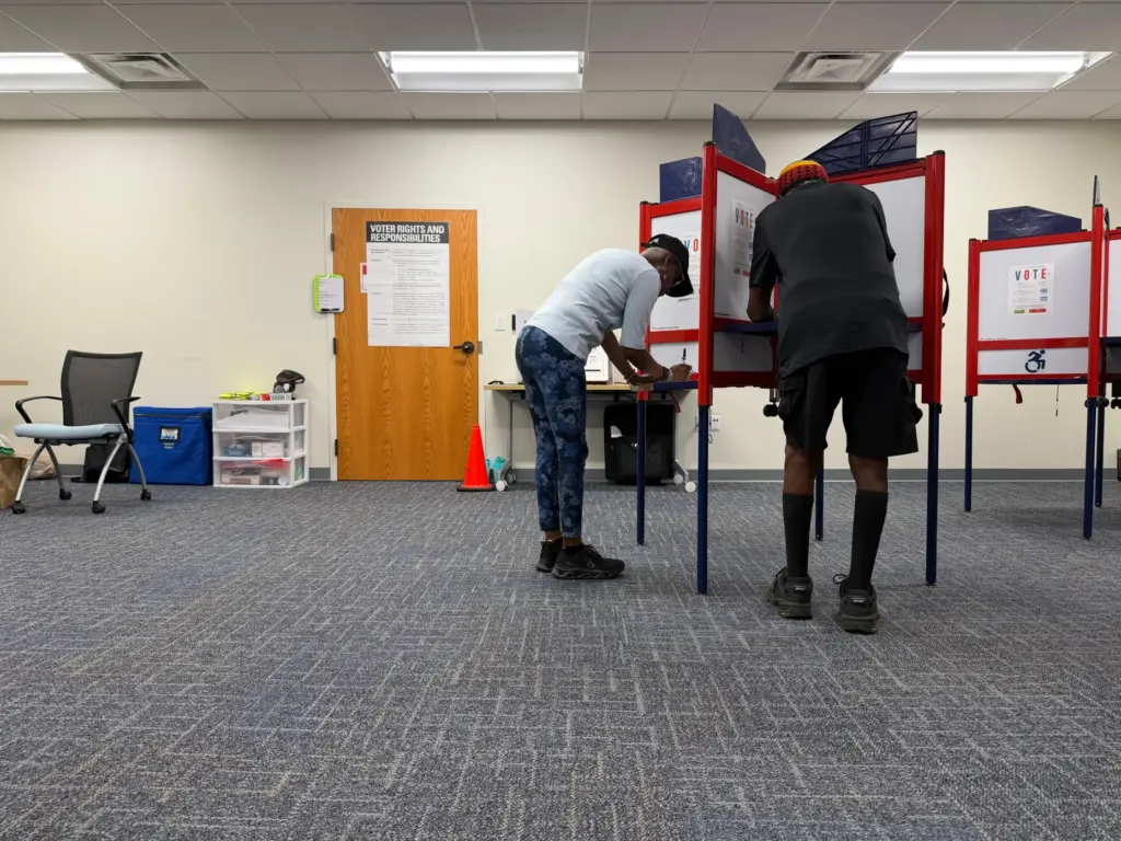 Voters cast ballots in Henrico County, Virginia, on the first...