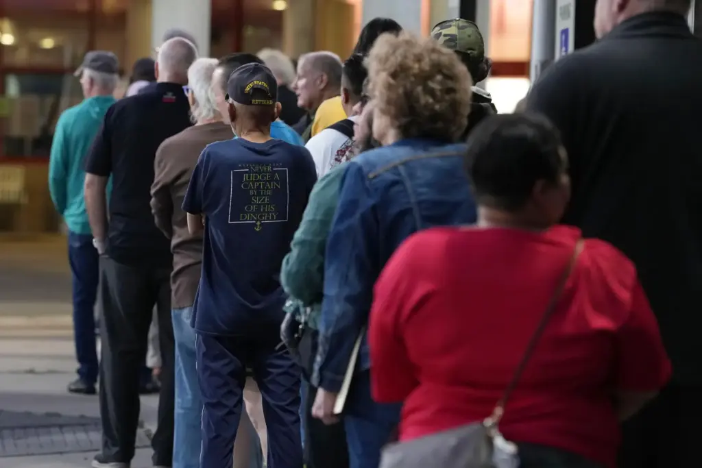 Voters line up for the first hour of early voting...