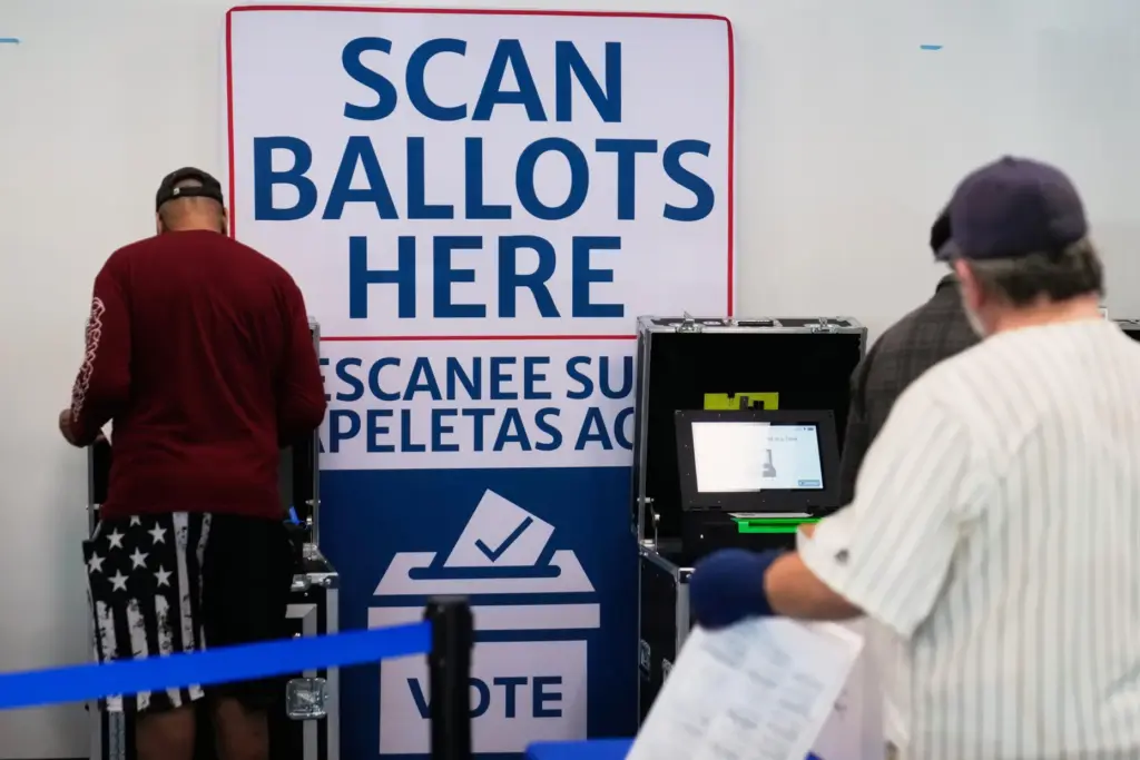 Voters scan their ballots at early in-person voting in Cleveland.