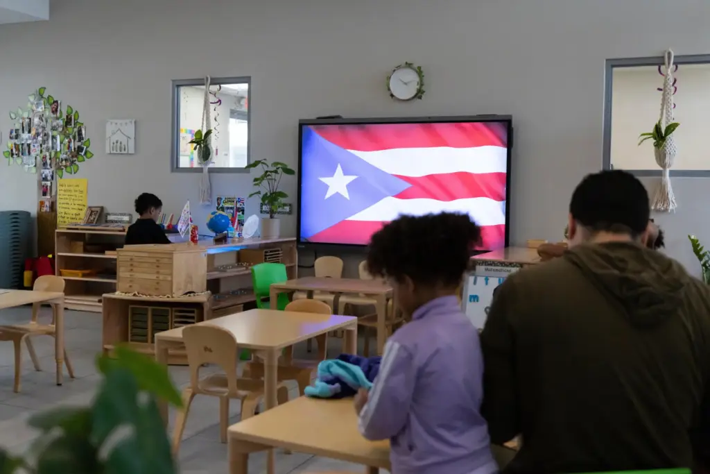 A Puerto Rican flag is displayed on a screen in...