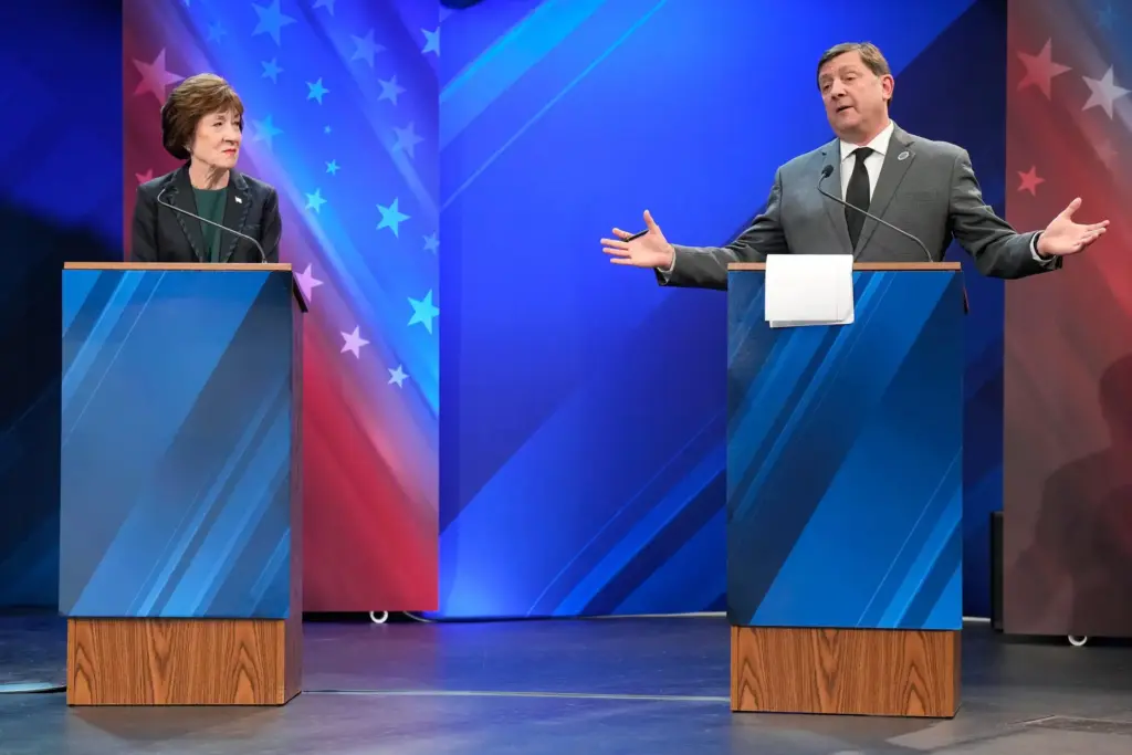 Sen. Susan Collins (R) looks to Troy Jackson (D) as...