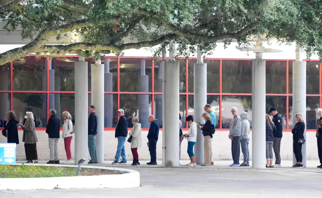 Voters line up for the first hour of early voting...