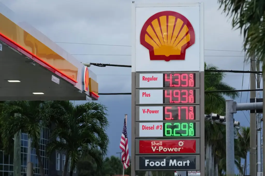 Gas and diesel prices are displayed at a Shell station,...